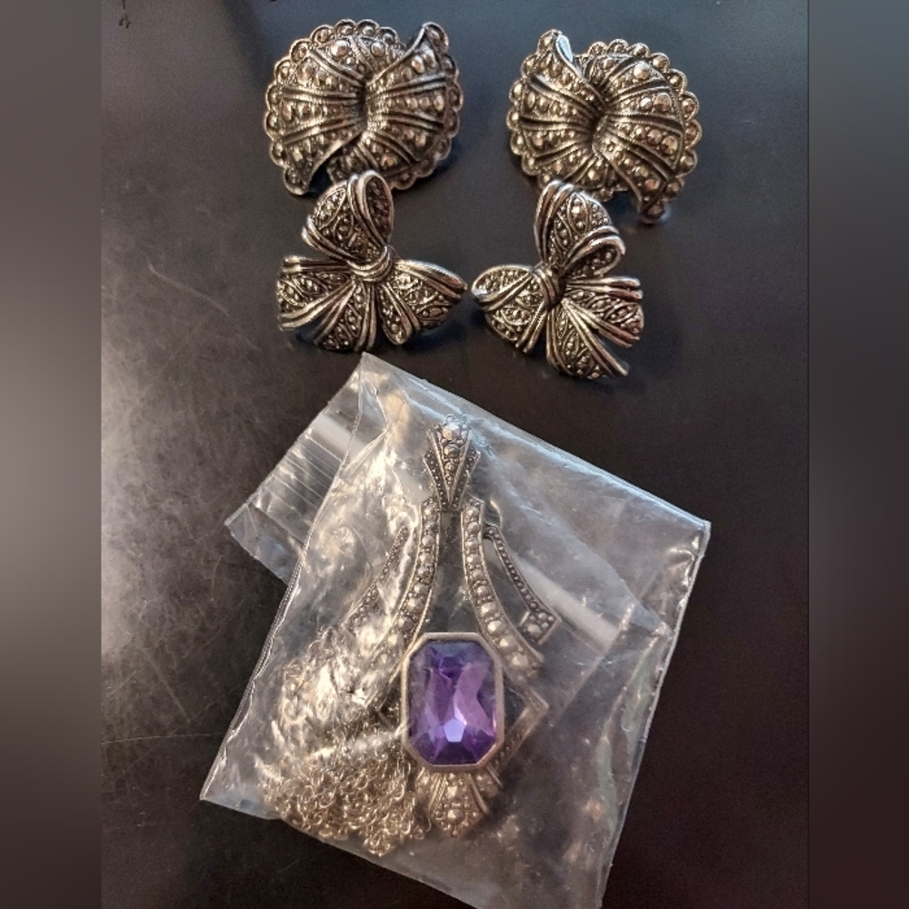 Avon necklace with 2 pair earrings.